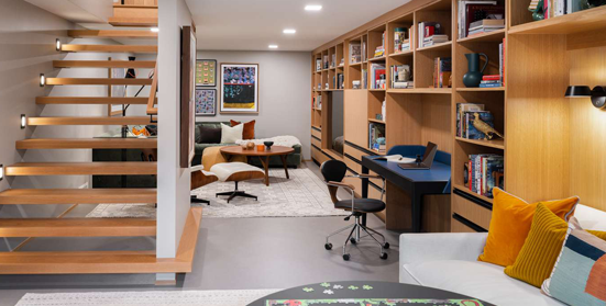 Custom finished basement featuring a built-in study area