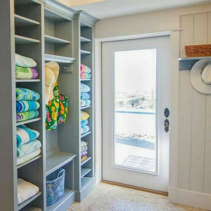 Custom built-in pool house storage for towels, equipment, toys and gear