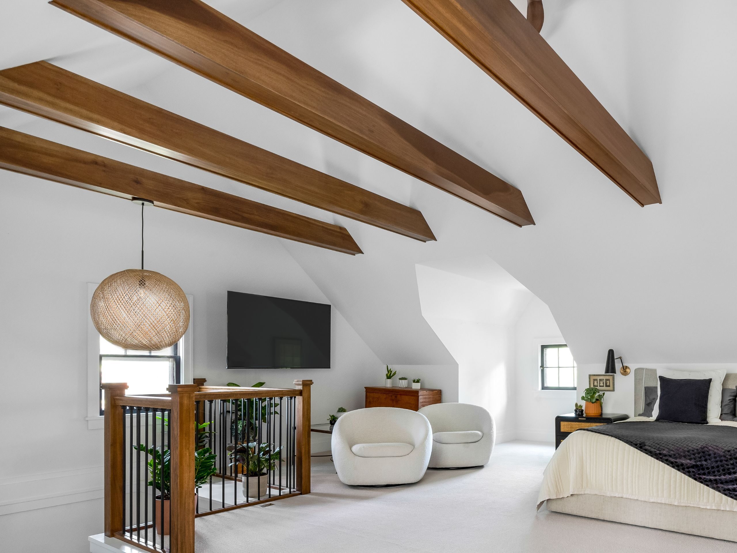 vaulted ceiling in attic with exposed veneered beams